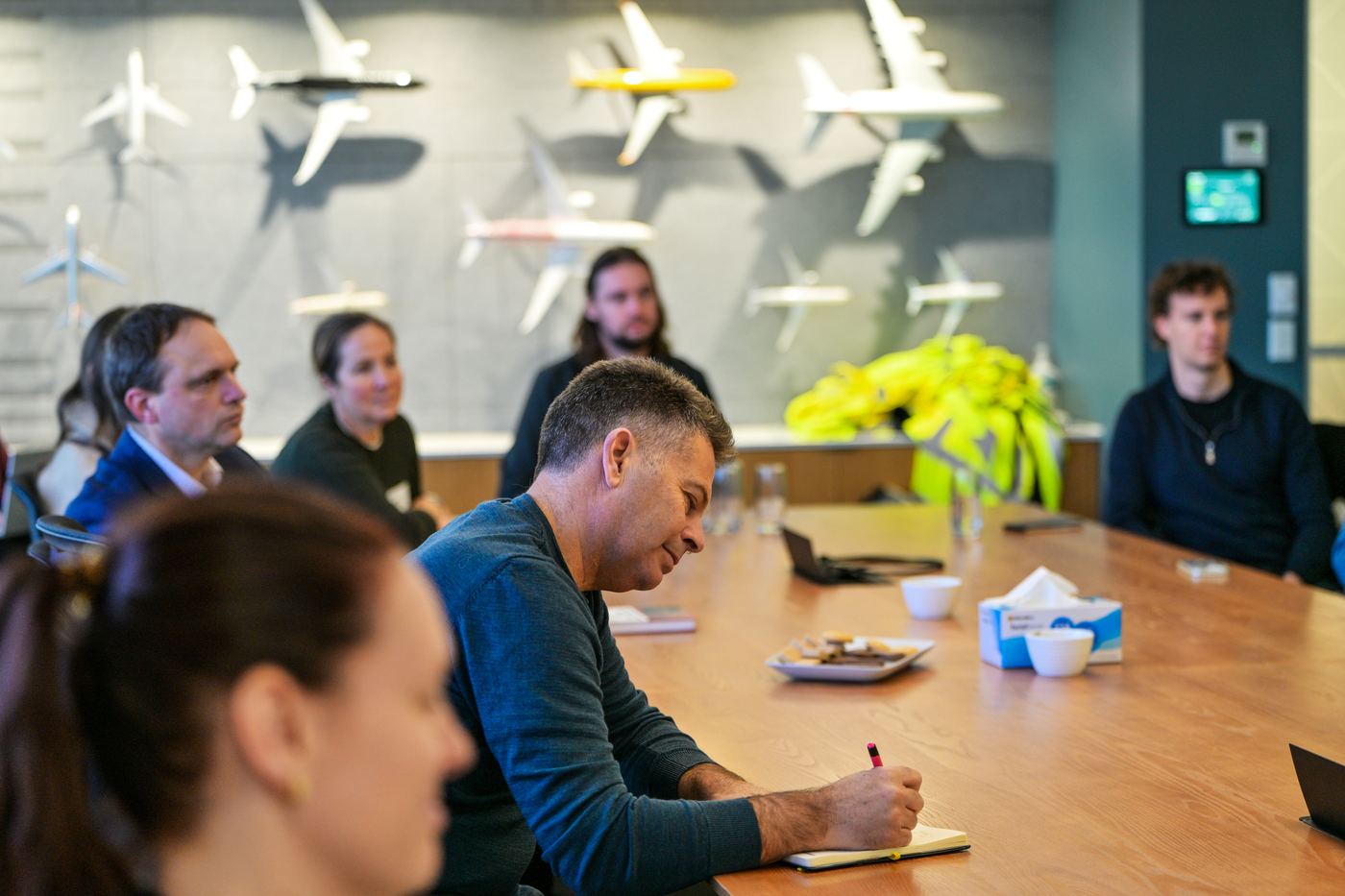 Tour participants in the Christchurch Airport boardroom during the sustainability briefing