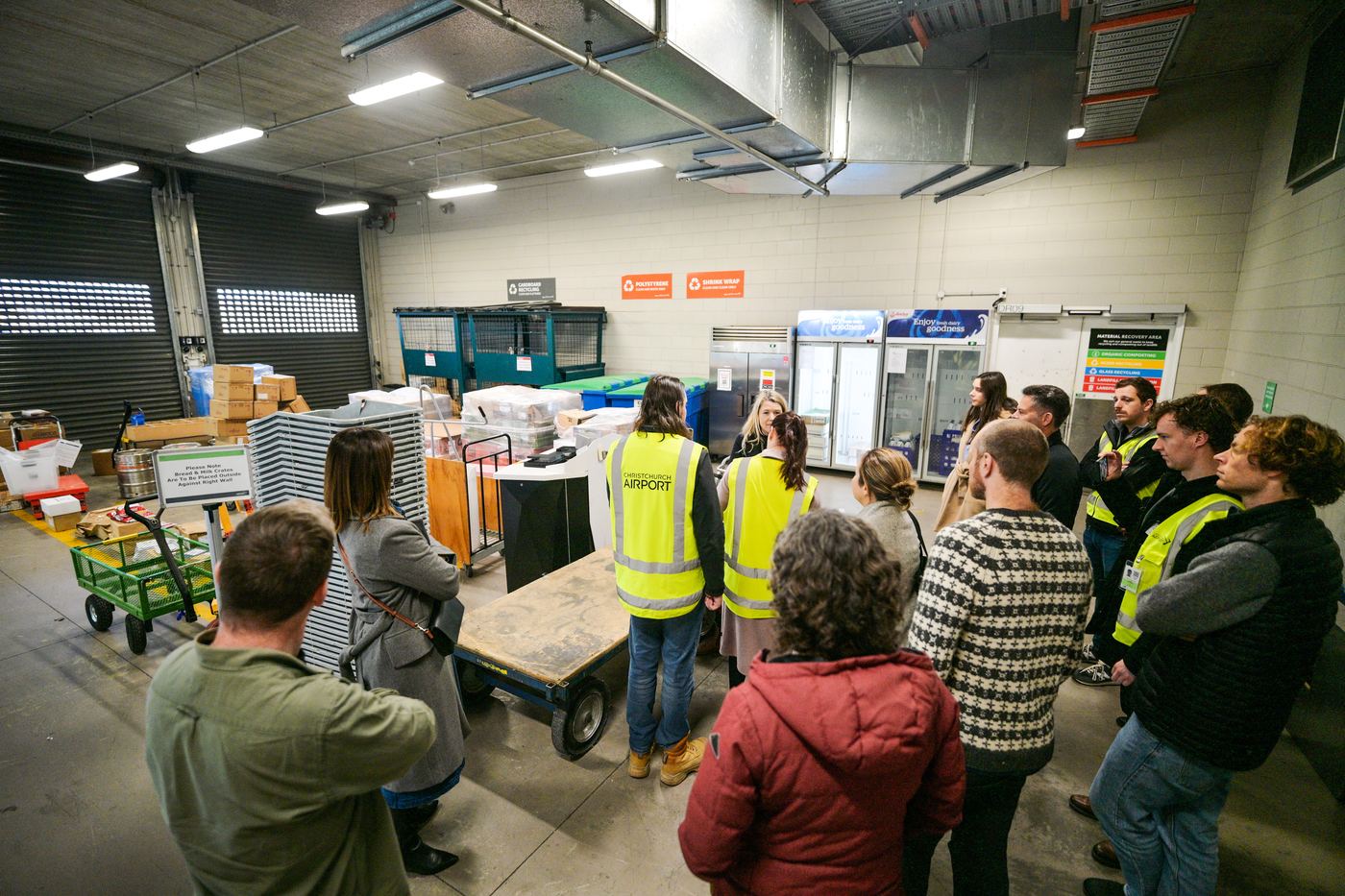Tour group in the back-of-house waste sorting room at Christchurch Airport